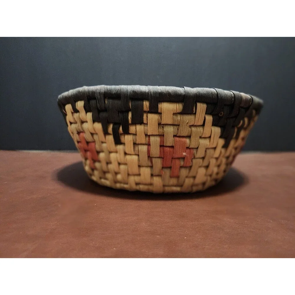 This handmade, round basket resembles those traditionally crafted by artisans.